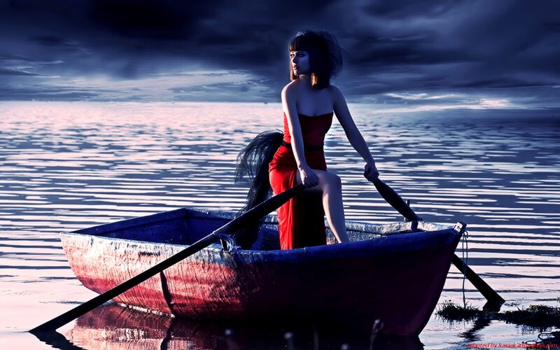 woman in red dress on a boat