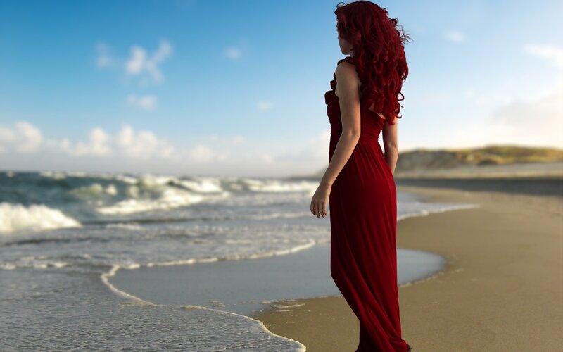 woman in red dress on beach