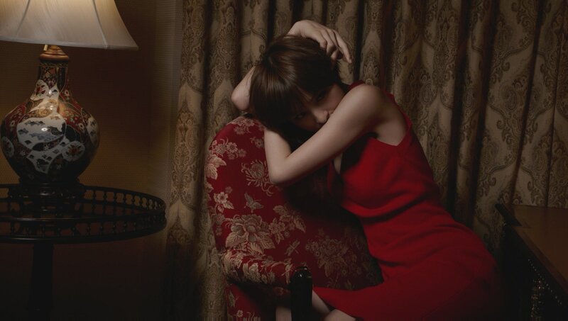 woman in red dress on chair