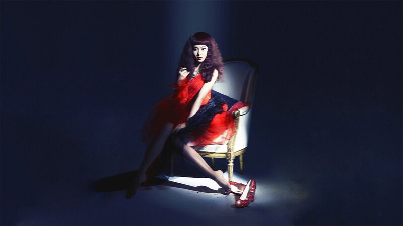 woman in red dress on chair