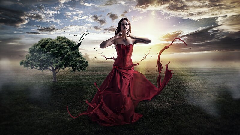 woman in red dress on field
