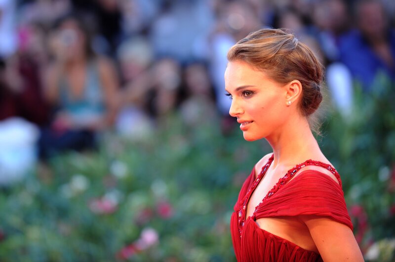 woman in red dress on red carpet
