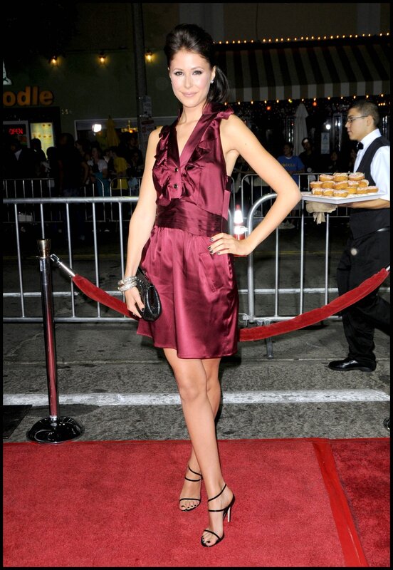 woman in red dress on red carpet
