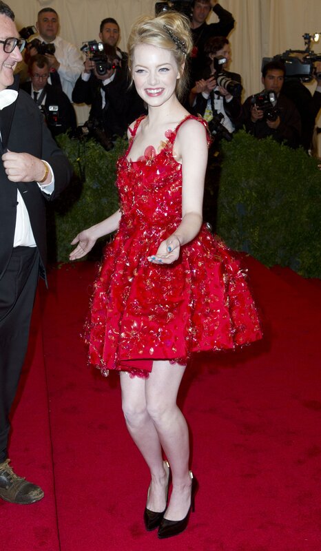 Woman in red dress on red carpet