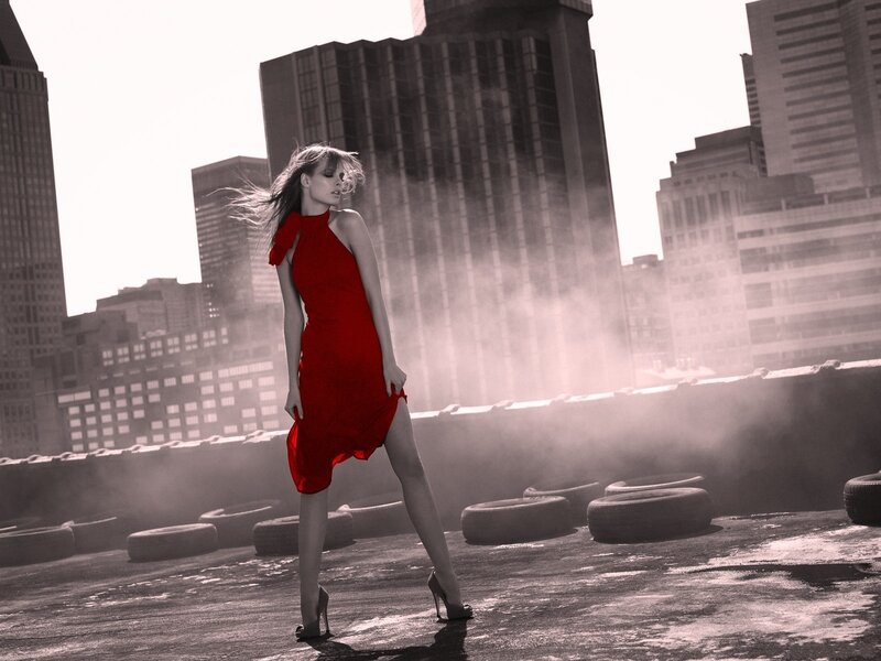 Woman in red dress on rooftop