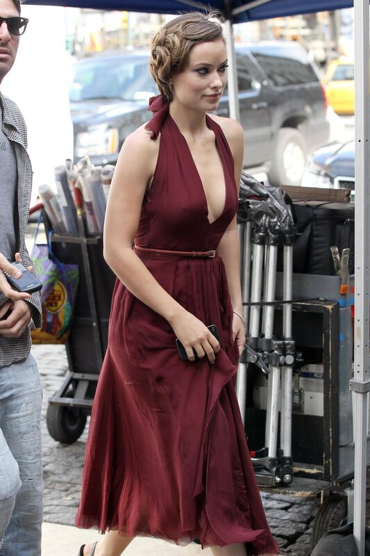 Woman in red dress on set