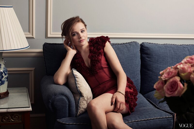 woman in red dress on sofa