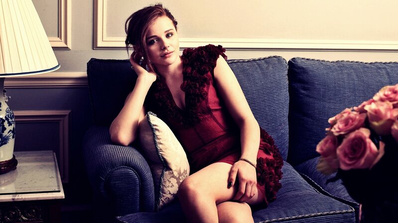 woman in red dress on sofa
