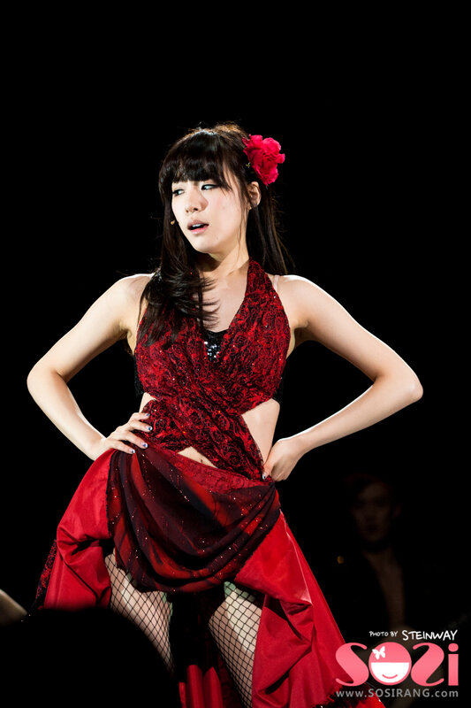 Woman in red dress on stage