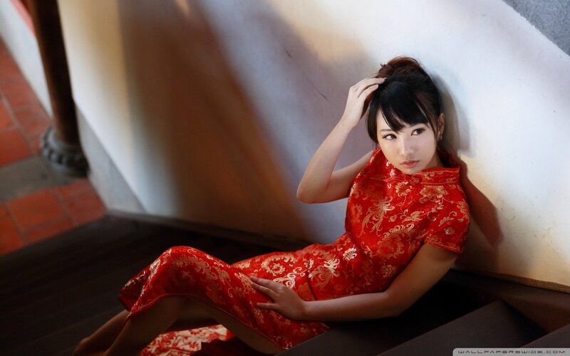 woman in red dress on stairs