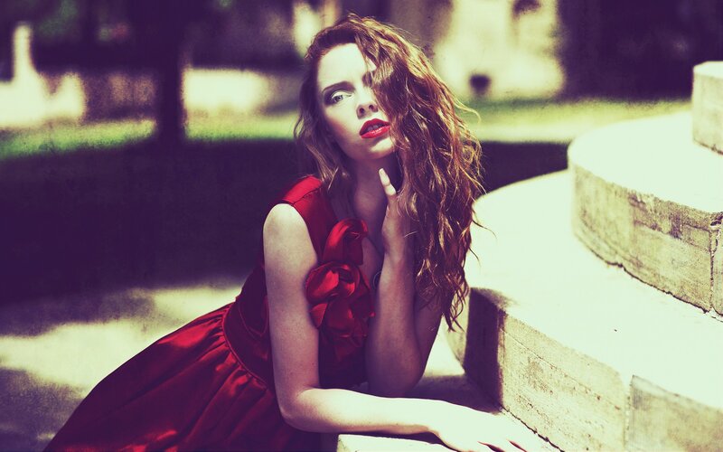 woman in red dress on steps