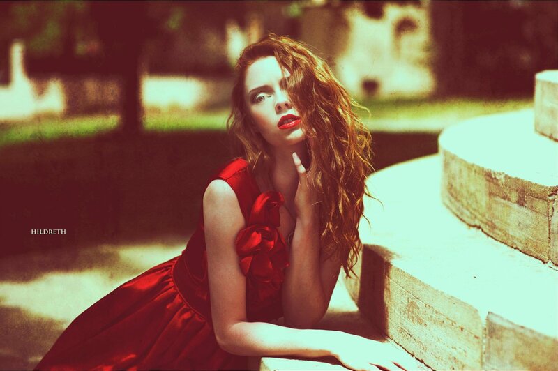 woman in red dress on steps