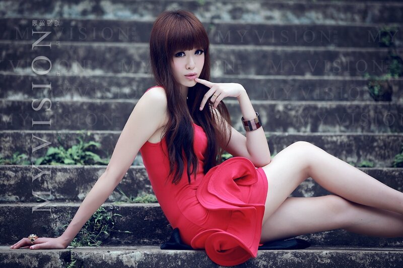 Woman in red dress on steps