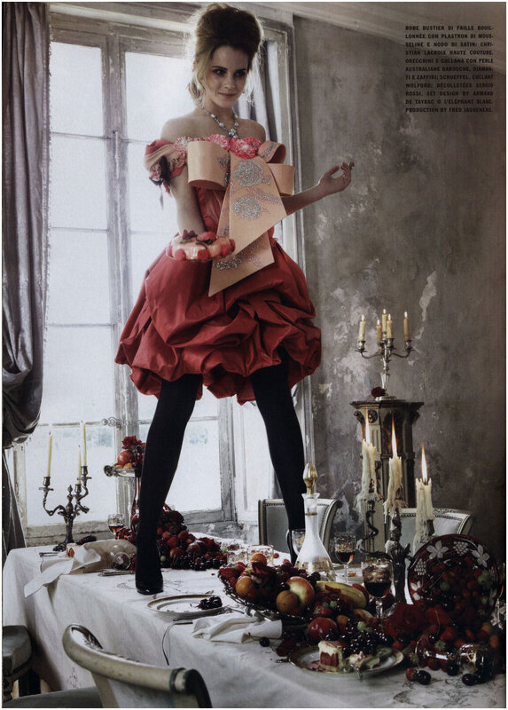 Woman in red dress on table