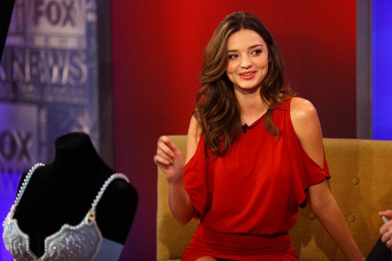 woman in red dress on talk show