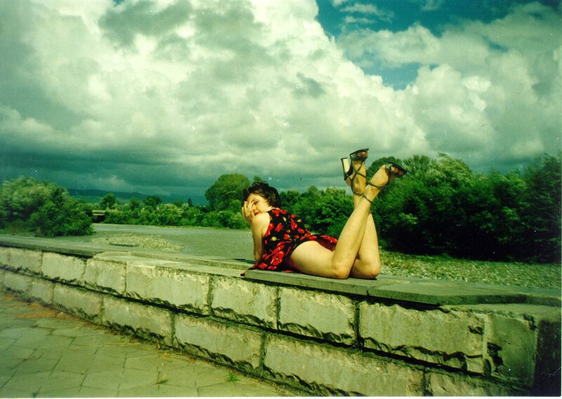 Woman in red dress on wall
