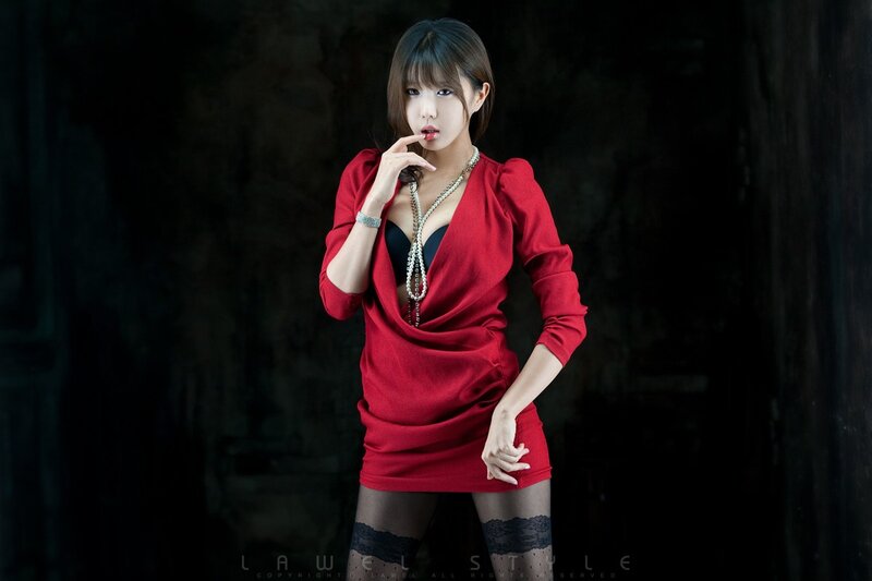 woman in red dress posing