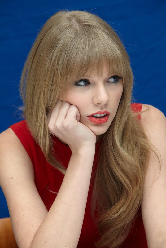 woman in red dress posing