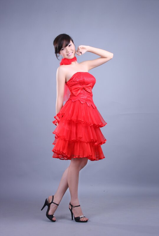 Woman in red dress posing