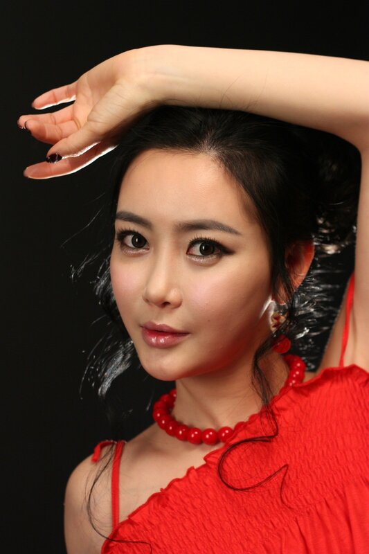 woman in red dress posing