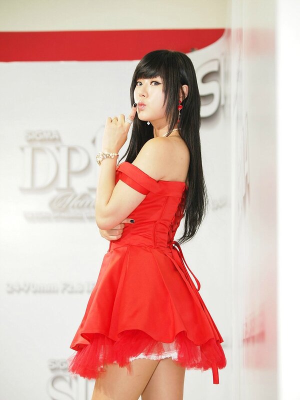woman in red dress posing
