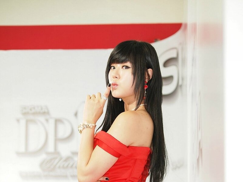 woman in red dress posing