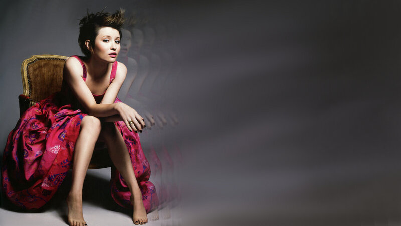 woman in red dress sitting
