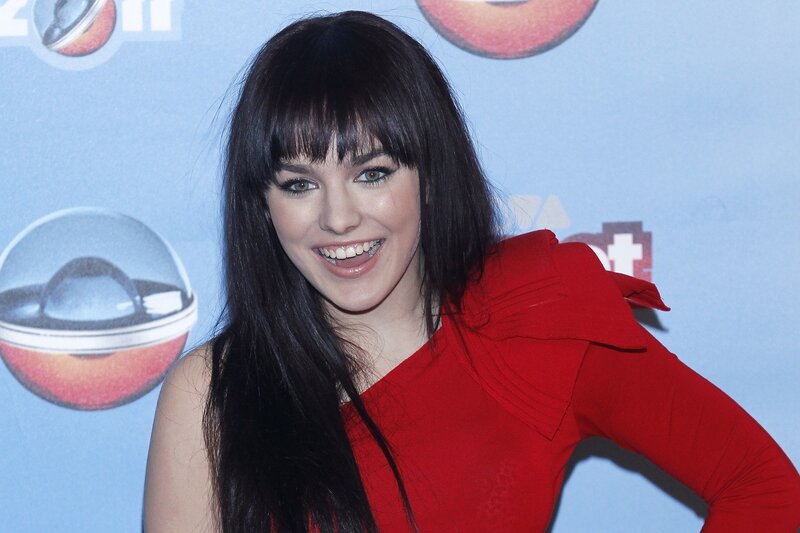 woman in red dress smiling