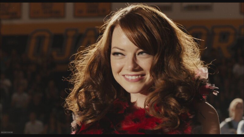 woman in red dress smiling