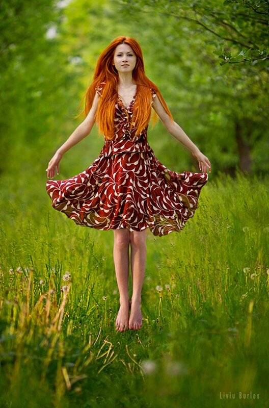 Woman in red dress spinning