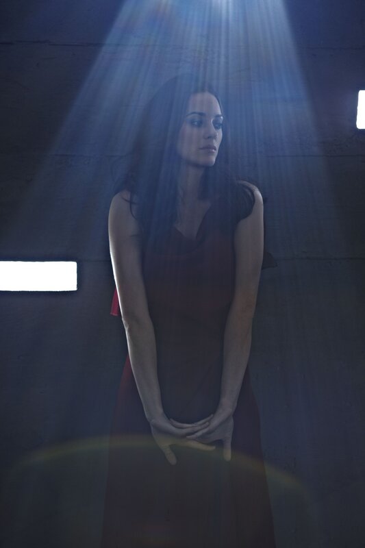 woman in red dress under light