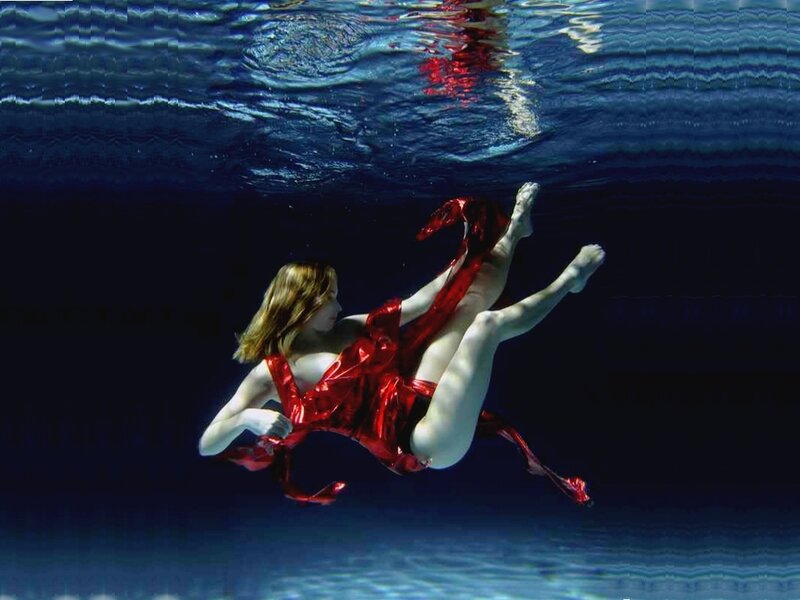 Woman in Red Dress Underwater — Dramatic