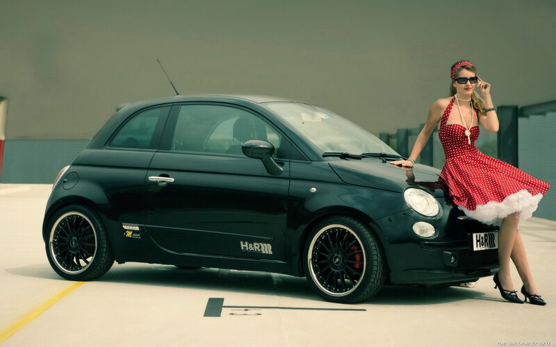Woman in red dress with black car
