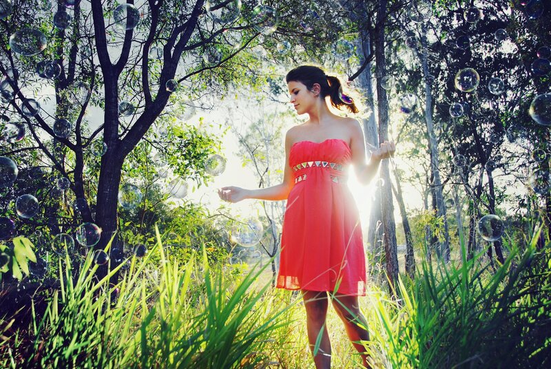 Woman in red dress with bubbles