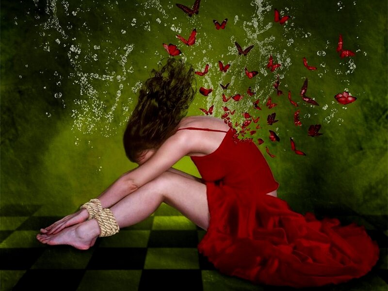 Woman in red dress with butterflies