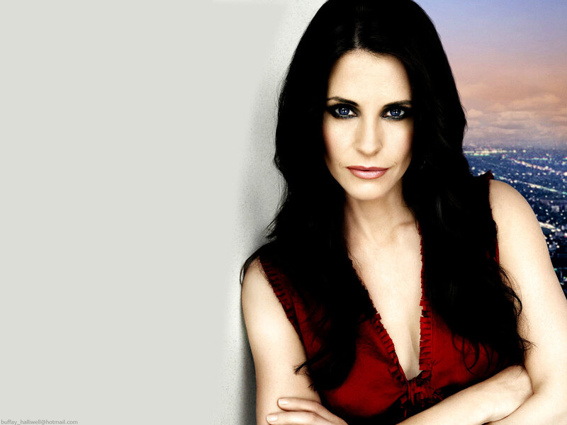 Woman in red dress with city view