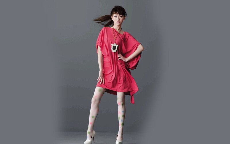 woman in red dress with colorful tights