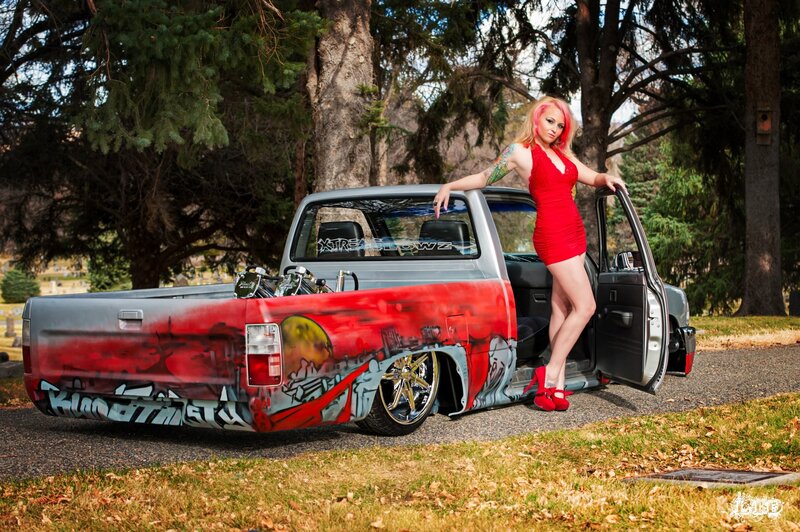 woman in red dress with custom truck
