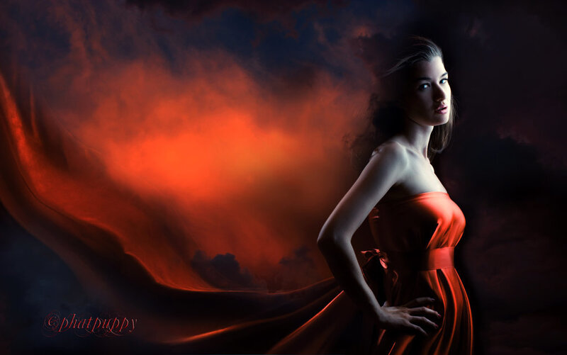 woman in red dress with dramatic lighting