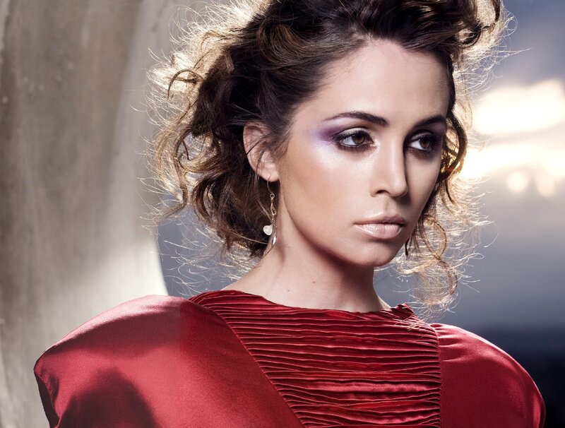 woman in red dress with dramatic makeup