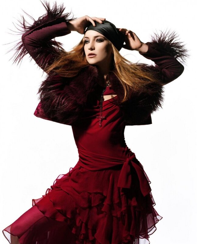 woman in red dress with feathered jacket