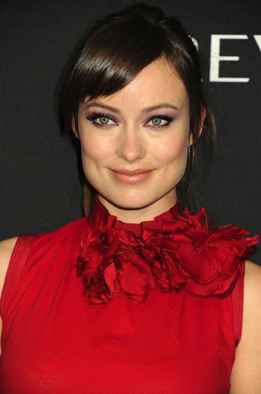 woman in red dress with floral collar