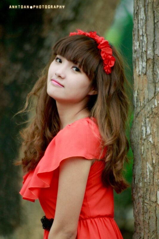 Woman in red dress with flower crown