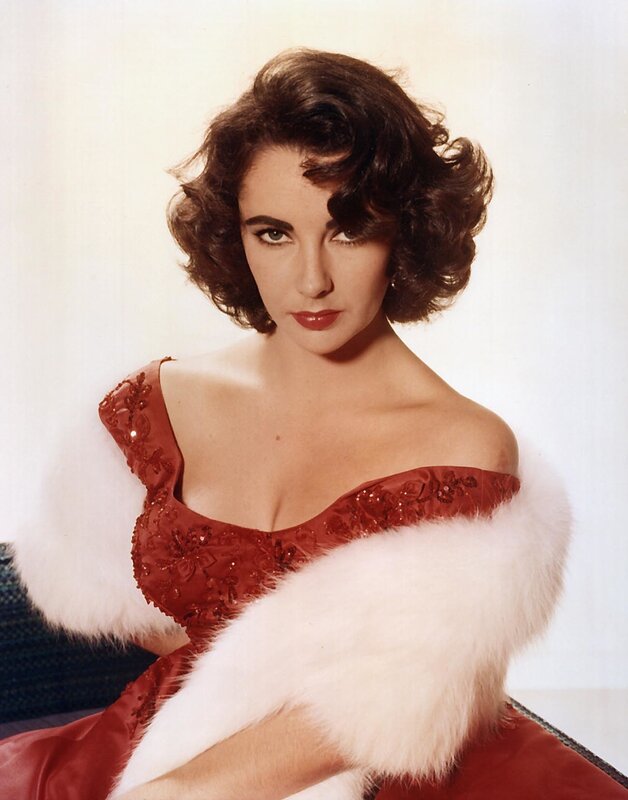 Woman in red dress with fur stole
