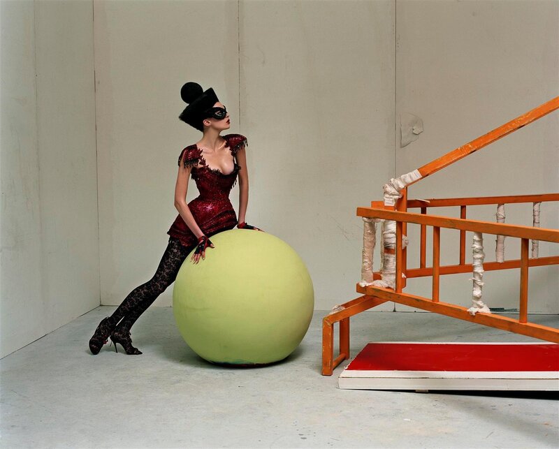 woman in red dress with green ball