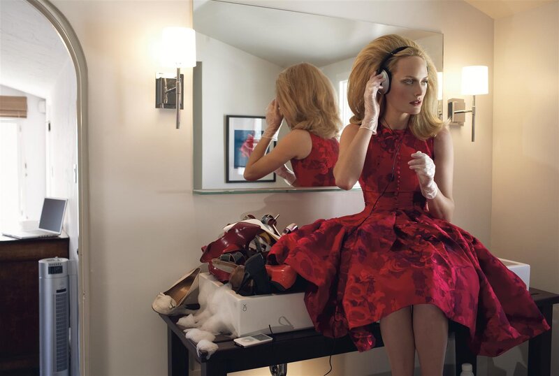 Woman in red dress with headphones