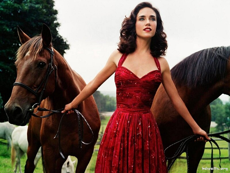 Woman in red dress with horses