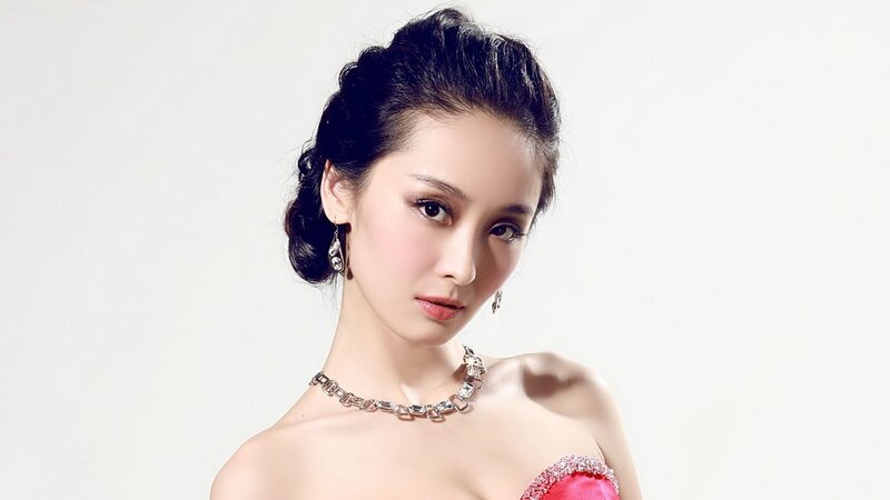 woman in red dress with jewelry