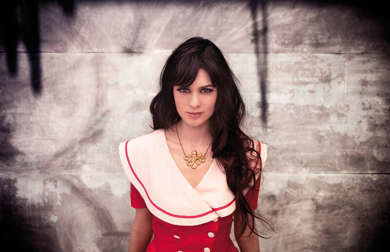 woman in red dress with octopus necklace