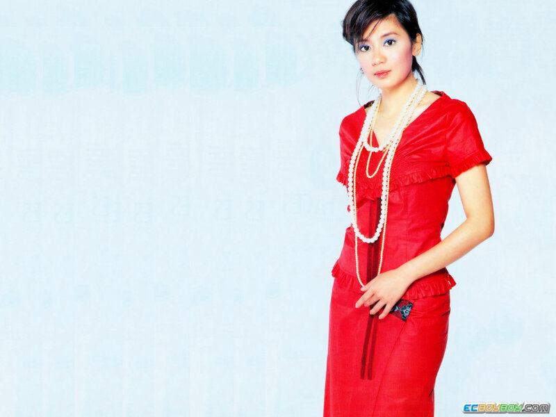 woman in red dress with pearls